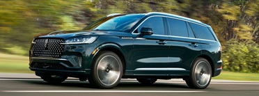 2026 Lincoln Aviator driving down the road