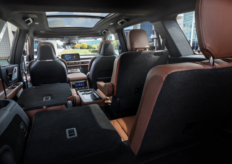 The interior of the 2025 Lincoln Aviator® SUV is shown with two seats folded down for added space. | Planet Lincoln Love Field in Dallas TX