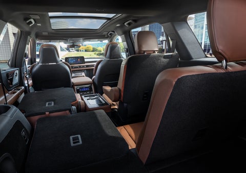The interior of the 2025 Lincoln Aviator® SUV is shown with two seats folded down for added space. | Planet Lincoln Love Field in Dallas TX