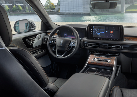 The interior of the 2025 Lincoln Aviator® SUV is shown parked with a view of a harbor through the windshield. | Planet Lincoln Love Field in Dallas TX