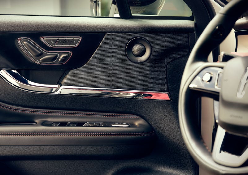 An audio speaker is shown in the driver's side door of a 2024 Lincoln Corsair® SUV. | Planet Lincoln Love Field in Dallas TX