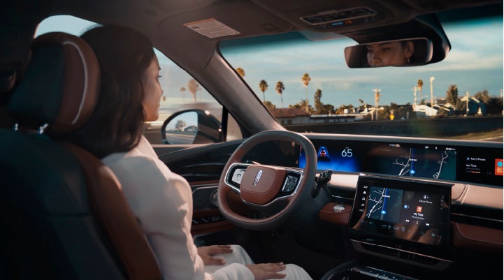 A person is shown driving hands-free on the highway with available Lincoln BlueCruise technology. | Planet Lincoln Love Field in Dallas TX