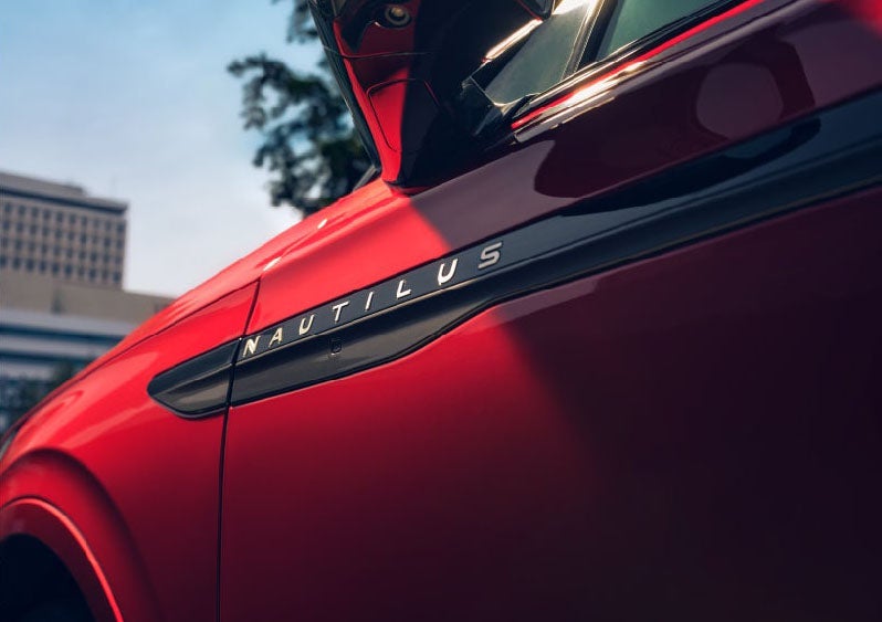 A side badge on the passenger door reads Nautilus. | Planet Lincoln Love Field in Dallas TX