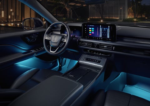 Deep blue Ambient Lighting glows from various places within a 2026 Lincoln Aviator® SUV. | Planet Lincoln Love Field in Dallas TX