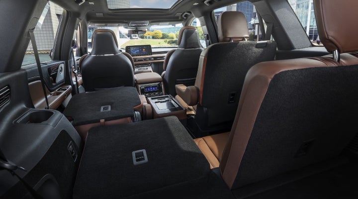 One side of the PowerFold® third-row seat and a second-row seat are folded forward in the 2026 Lincoln Aviator® SUV. | Planet Lincoln Love Field in Dallas TX
