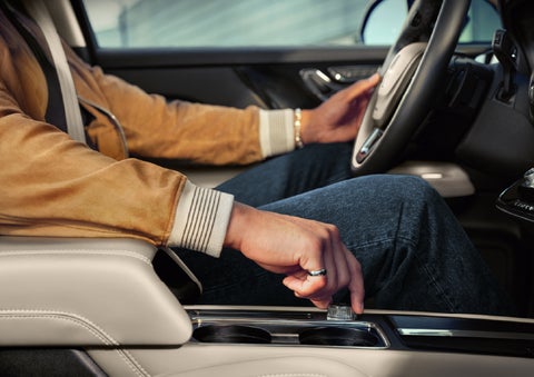 The driver of a 2026 Lincoln Corsair® SUV is shown selecting a drive mode. | Planet Lincoln Love Field in Dallas TX