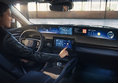 The driver of a 2026 Lincoln Nautilus® SUV interacts with the center touchscreen. | Planet Lincoln Love Field in Dallas TX