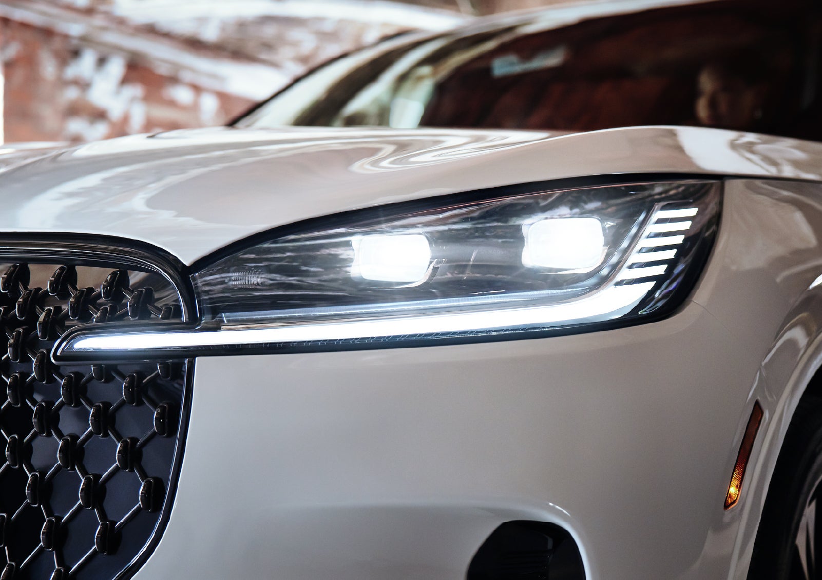 A close-up of a headlamp on the 2027 Lincoln Aviator® SUV is shown. | Planet Lincoln Love Field in Dallas TX