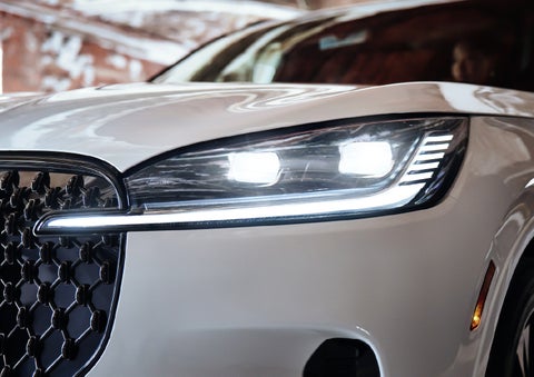 A close-up of a headlamp on the 2027 Lincoln Aviator® SUV is shown. | Planet Lincoln Love Field in Dallas TX