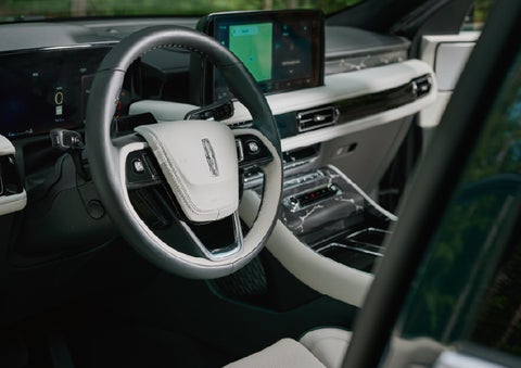 The leather-trimmed steering wheel of a 2027 Lincoln Aviator® Black Label™ SUV. | Planet Lincoln Love Field in Dallas TX